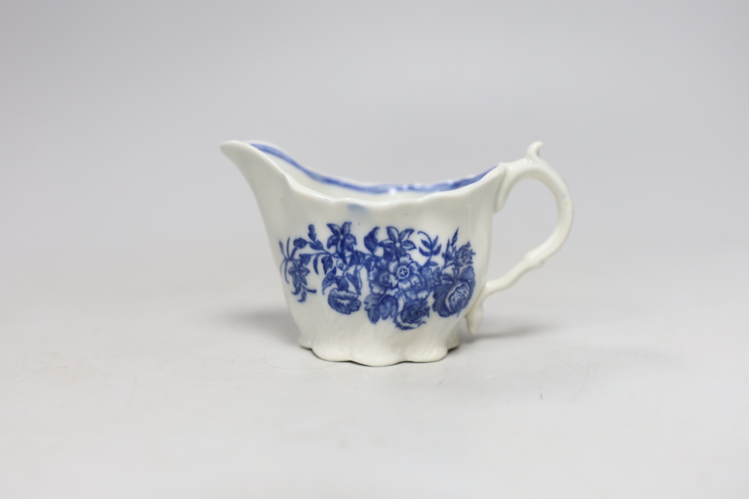 An 18th century Caughley Low Chelsea ewer printed with flowers, 6.5 cms high